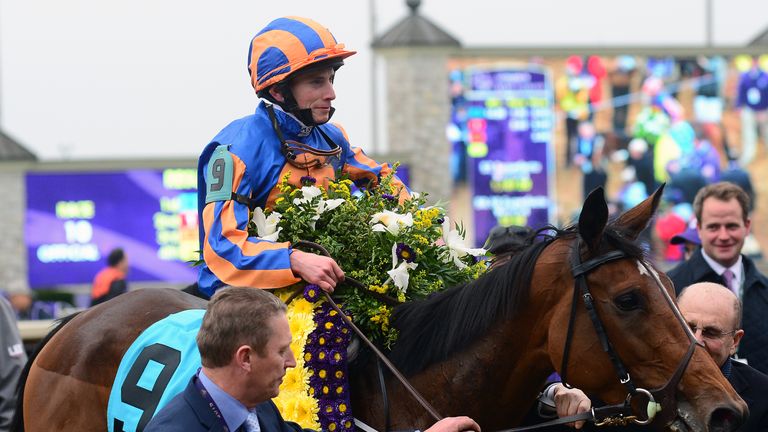 Ryan Moore heads to the winner's circle after winning the Breeders' Cup Turf atop Found