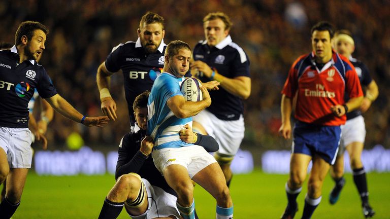 Argentina's wing Santiago Cordero (C) is tackled during the rugby union test match between Scotland and Argentina at Murrayfield stadium in Edinburgh on No