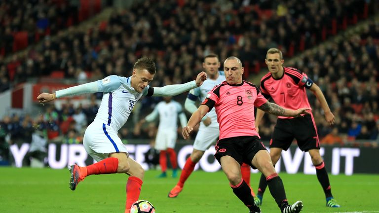 LONDON, ENGLAND - NOVEMBER 11:  Jamie Vardy of England is faced by Scott Brown of Scotland during the FIFA 2018 World Cup qualifying match between England 