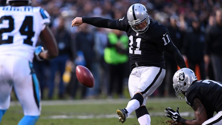 OAKLAND, CA - NOVEMBER 27:  Sebastian Janikowski #11 of the Oakland Raiders kicks the 23-yard game winning field goal against the Carolina Panthers during 