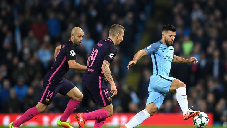 MANCHESTER, ENGLAND - NOVEMBER 01: Sergio Aguero of Manchester City (R) is chased down by Lucas Digne of Barcelona (C) and Javier Mascherano of Barcelona (