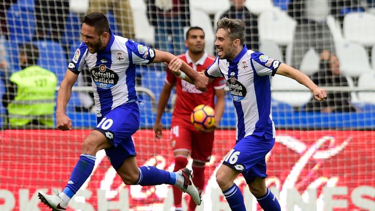 Deportivo La Coruna's Romanian forward Florin Andone (L) celebrates a goal with teammate Portuguese defender Luisinho during the Spanish league football ma
