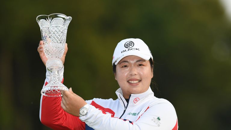Shanshan Feng poses with the trophy after winning the TOTO Japan Classic