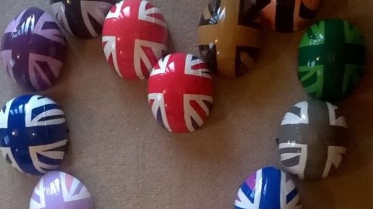 Elise Christie shows off the team's helmets in Canada (Twitter @Elise_Christie)