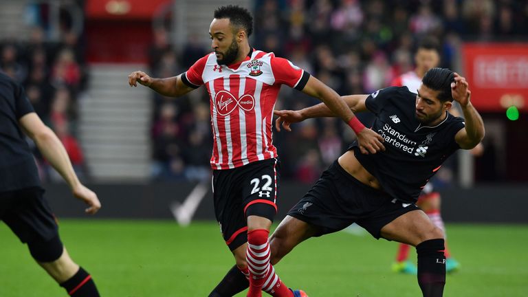 Southampton midfielder Nathan Redmond (L) vies with Liverpool's Emre Can 