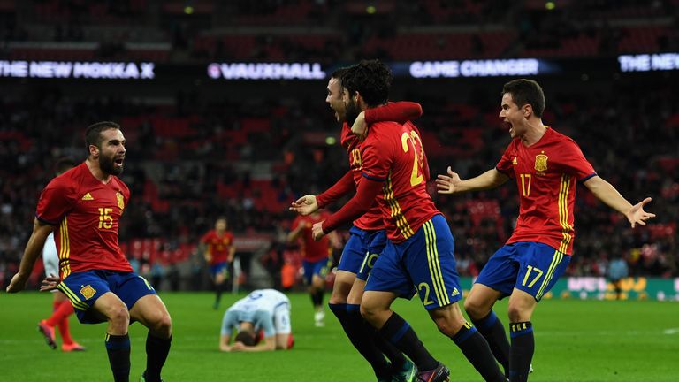 LONDON, ENGLAND - NOVEMBER 15:  Isco of Spain (22) celebrates with team mates as he scores their second and equalising goal during the international friend