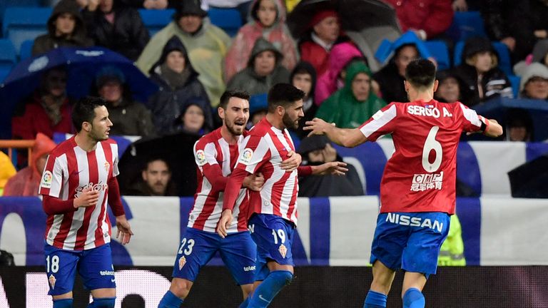 Sporting Gijon's Carlos Carmona celebrates his goal with teammates