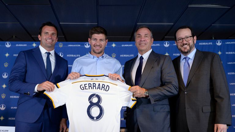 Los Angeles Galaxy midfielder Steven Gerrard (2nd L) poses with coach Bruce Arena (2nd R)