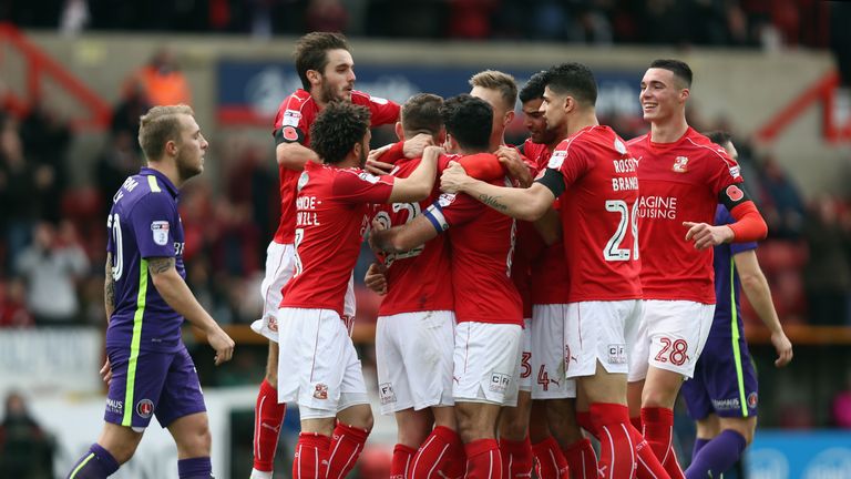 SWINDON, ENGLAND - NOVEMBER 12:  Swindon Town celebrate after an own goal by Charlton gave them a 1-0 lead during the Sky Bet League One match between Swin