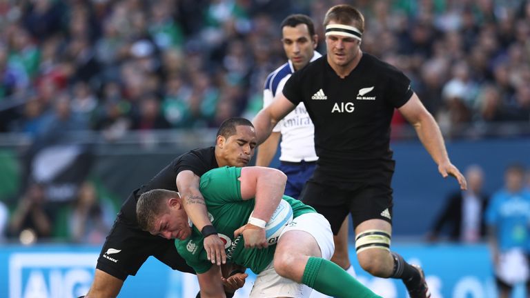 Tadhg Furlong of Ireland is tackled by Aaron Smith 