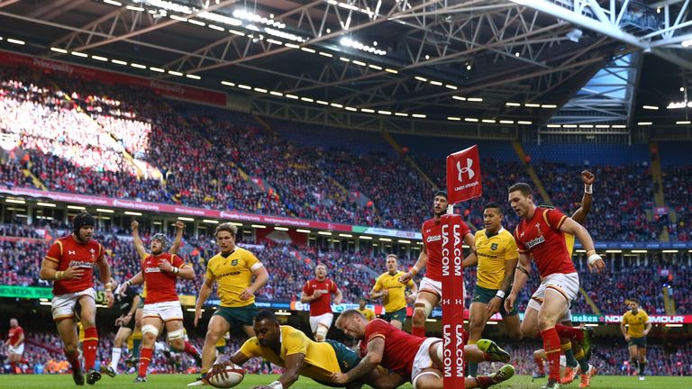 Tevita Kuridrani of Australia powers over to score his team's third try 