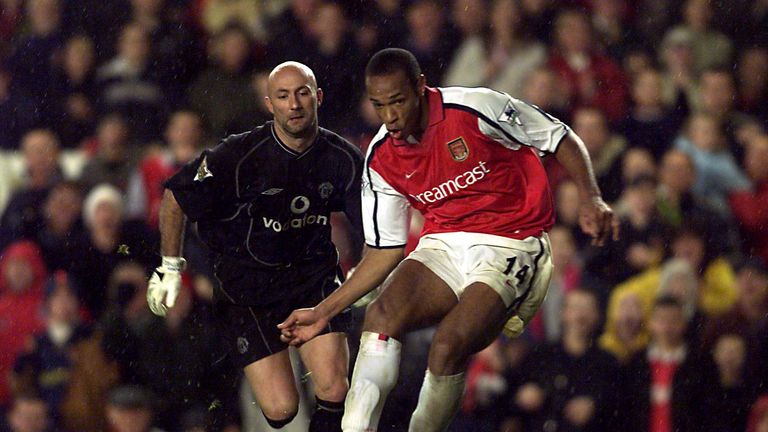 25 Nov 2001:  Thierry Henry of Arsenal beats Manchester Keeper Fabien Barthez during the FA Barclaycard Premiership match between Arsenal and Manchester Un