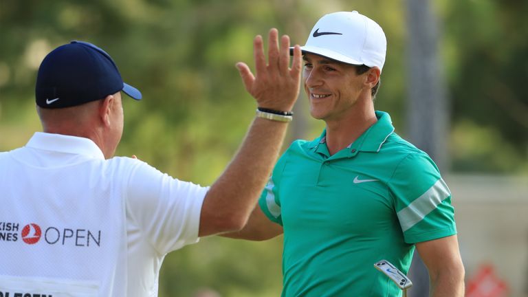 ANTALYA, TURKEY - NOVEMBER 06:  Thorbjorn Olesen of Denmark celebrates victory on the 18th green with caddie Dominic Bott during day four of the Turkish Ai