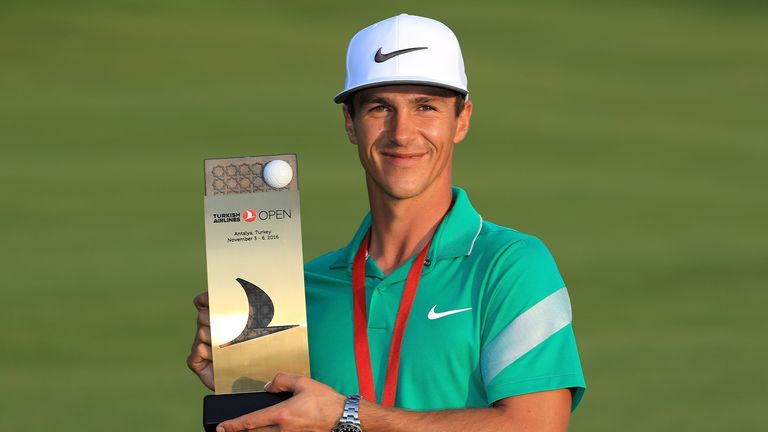 Thorbjorn Olesen of Denmark poses with the trophy following his victory at the Turkish Airlines Open