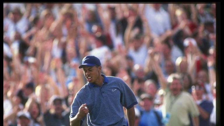 Tiger Woods celebrates after making a hole in one during the Phoenix Open at the TPC of Scottsdale in 1997