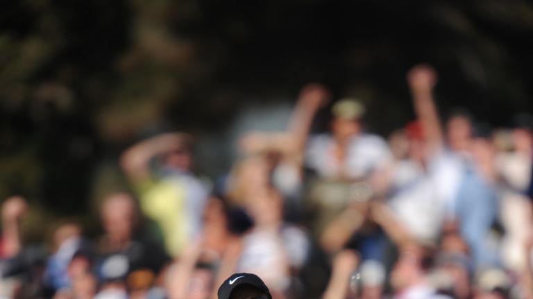 Tiger Woods of the US celebrates his birdie putt on the 18th hole in the fourth round of the 108th U.S. Open golf tournament forcing a playoff with compatr