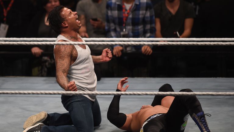 Former German soccer goalkeeper Tim Wiese (L) reacts during the WWE (World Wrestling Entertainment) Six-Man-Tag-Team-Match at the Olympic Hall in Munich, s