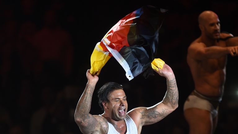 Former German soccer goalkeeper Tim Wiese celebrates after the WWE (World Wrestling Entertainment) Six-Man-Tag-Team-Match at the Olympic Hall in Munich, so