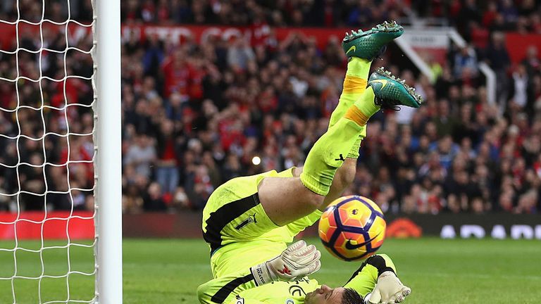 MANCHESTER, ENGLAND - OCTOBER 29:  Thomas Heaton of Burnley makes a save during the Premier League match between Manchester United and Burnley at Old Traff