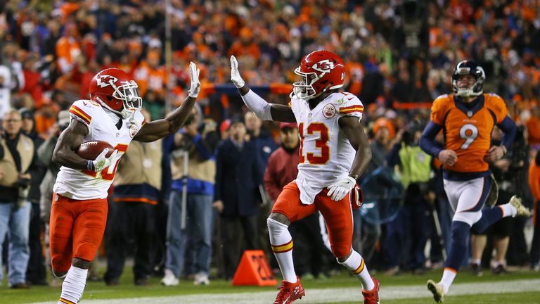 DENVER, CO - NOVEMBER 27:  Wide receiver Tyreek Hill #10 of the Kansas City Chiefs high fives De'Anthony Thomas #13 while returning a kickoff for a touchdo