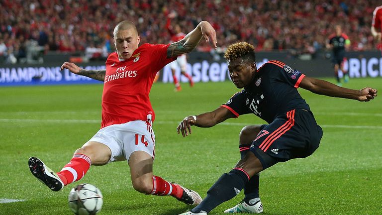  Victor Lindelof of Benfica challenges David Alaba of Bayern Muenchen