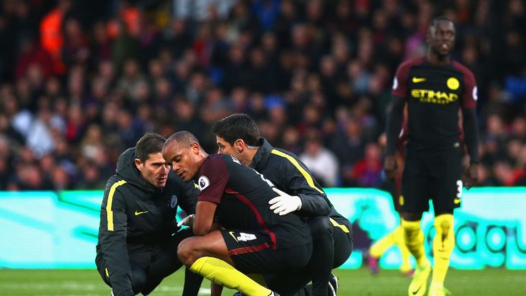 LONDON, ENGLAND - NOVEMBER 19: Vincent Kompany of Manchester City receives treatment from the medical team during the Premier League match between Crystal 