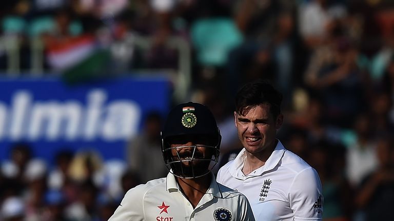 England's James Anderson (R) watches as India's captain Virat Kohli takes a run during the third day of the second Test cricket match between India and Eng