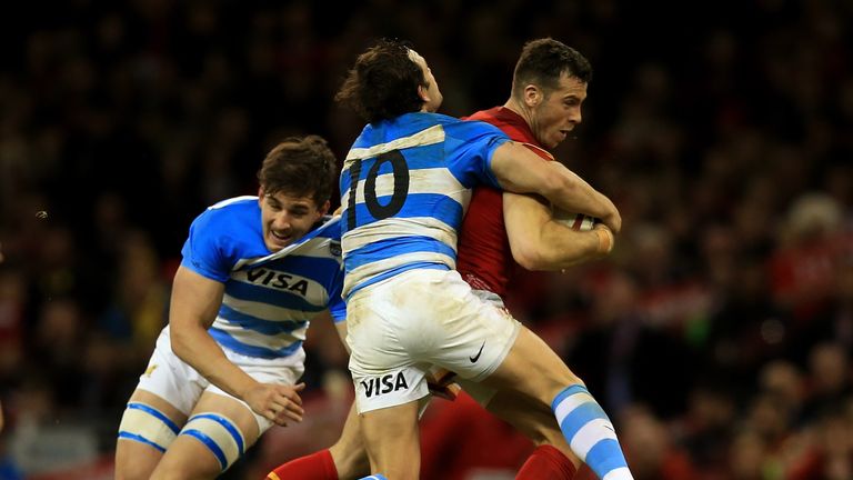 Gareth Davies of Wales is tackled by Nicolas Sanchez of Argentina