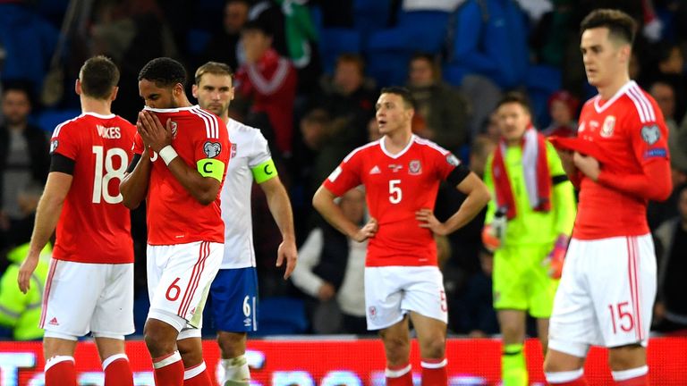 Wales players show their dejection after draw with Serbia