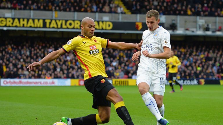 Watford's Younes Kaboul of Watford (L) tackles Marc Albrighton of Leicester 