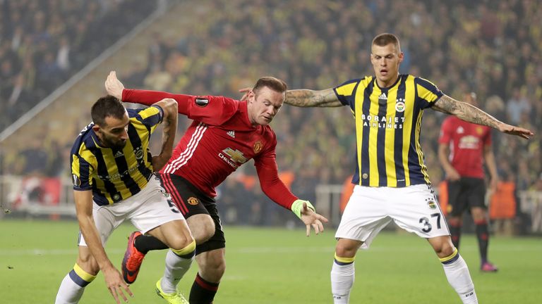 ISTANBUL, TURKEY - NOVEMBER 03:  Wayne Rooney of Manchester United battles for the ball with Mehmet Topal of Fenerbahce during the UEFA Europa League Group