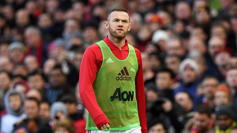 Wayne Rooney warms up on the touchline at Old Trafford