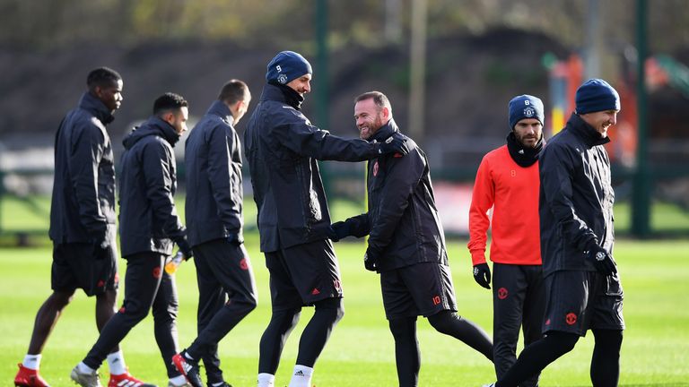 Zlatan Ibrahimovic and Wayne Rooney share a joke during training session