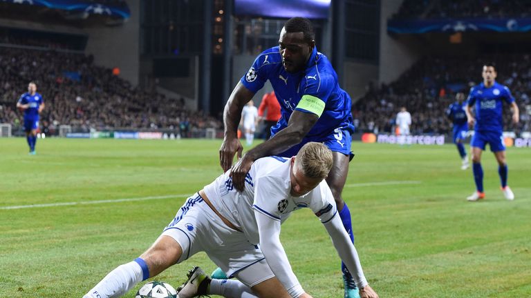 Leicester City's Jamaican defender Wes Morgan (top) vies with FC Copenhagen's Danish forward Andreas Cornelius during the UEFA Champions League group G foo