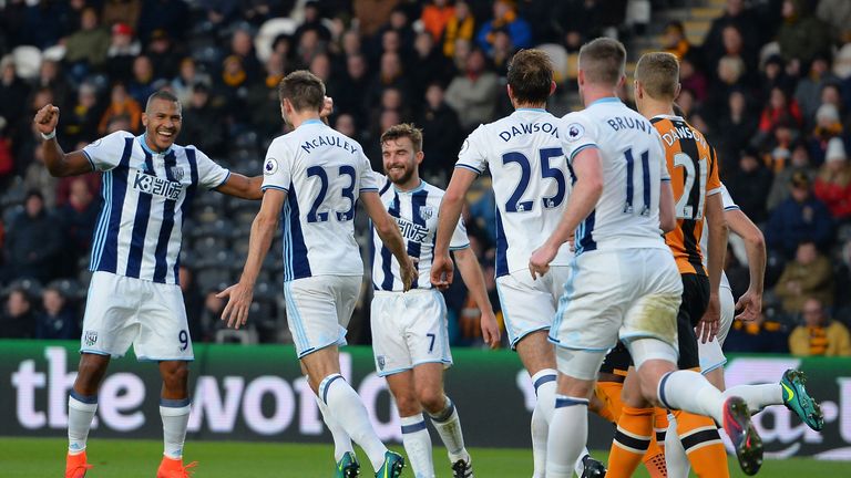 HULL, ENGLAND - NOVEMBER 26:  Gareth McAuley (2nd L) of West Bromwich Albion celebrates scoring the opening goal with his team mates during the Premier Lea
