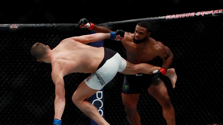 NEW YORK, NY - NOVEMBER 12:  Tyron Woodley of the United States (left) fights against Stephen Thompson of the United States in their welterweight champions