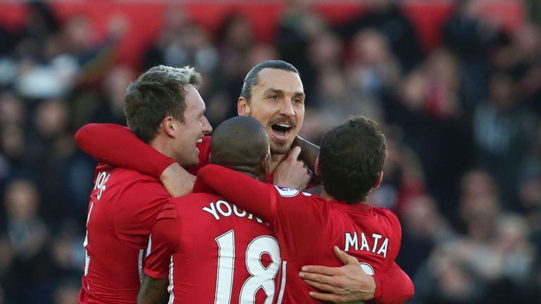 Zlatan Ibrahimovic (2R) celebrates scoring his team's second goal during the Premier League football match between Swansea City and Manchester United