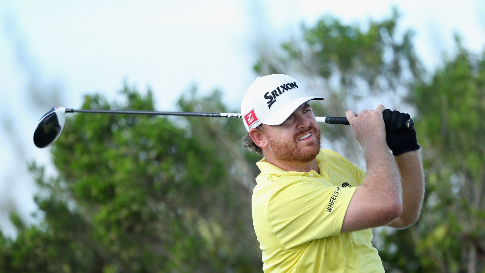 JB Holmes makes a splash as he attempts to get out of a hazard Golf