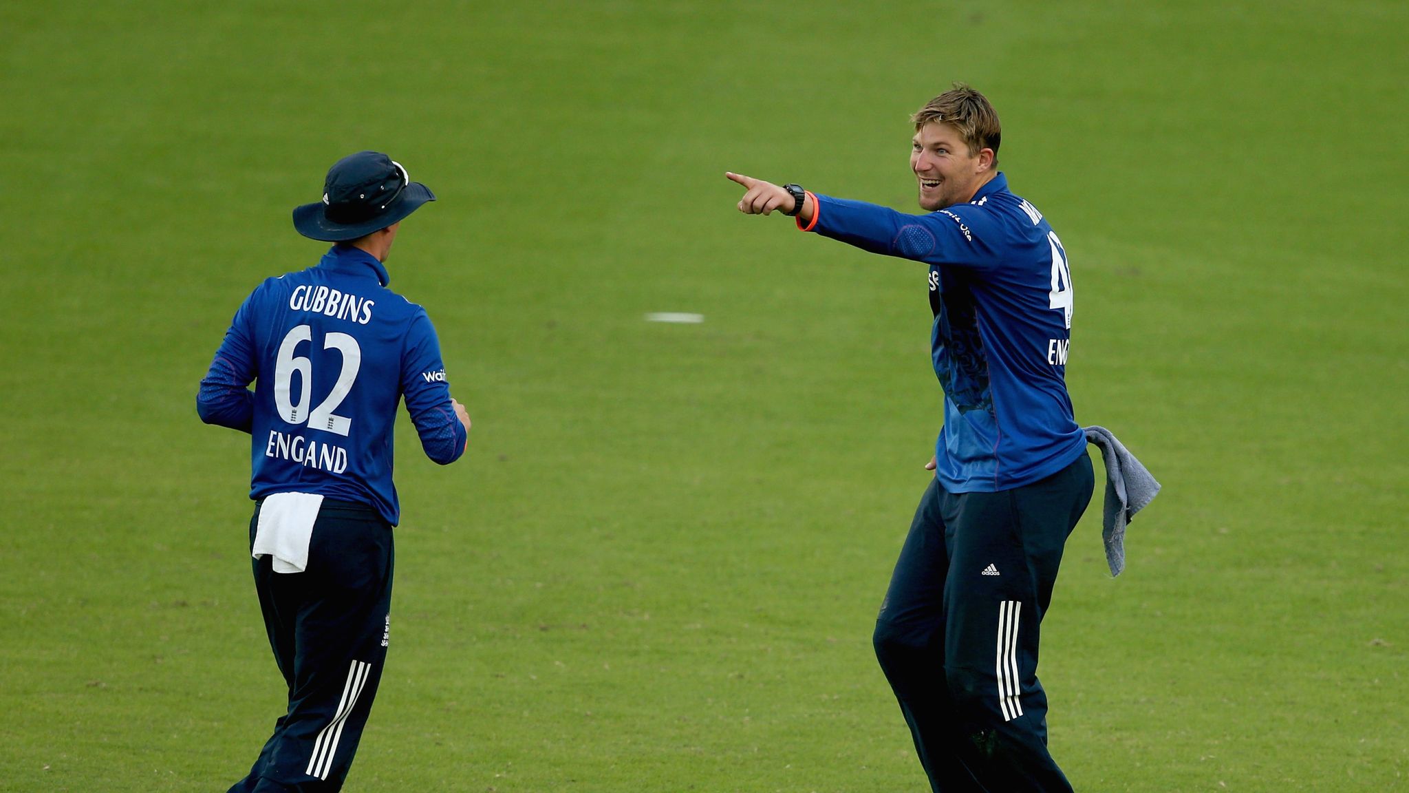 United Arab Emirates cricketers celebrate the dismissal of India's