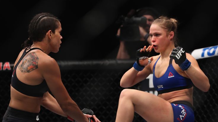 LAS VEGAS, NV - DECEMBER 30: (R-L) Ronda Rousey kicks Amanda Nunes of Brazil in their UFC women's bantamweight championship bout during the UFC 207 event o