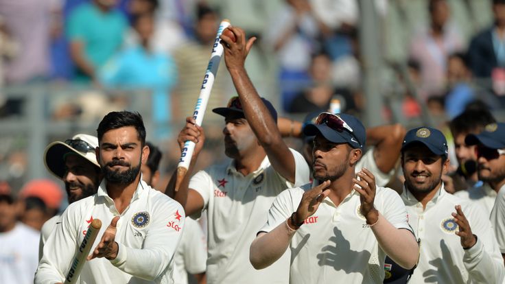 Virat Kohli leads India on a celebration lap after victory in Mumbai (Credit: AFP)