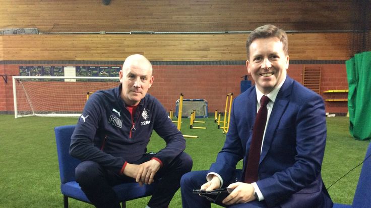 Sky Sports' David Tanner (R) interviews Rangers boss Mark Warburton
