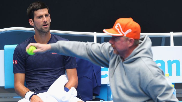 Novak Djokovic looks to Boris Becker during a practice session ahead of the 2016 Australian Open