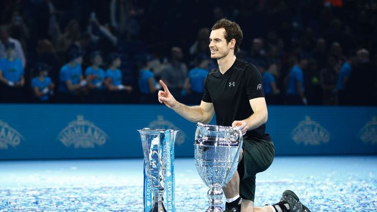 Britain's Andy Murray poses with both the ATP World Number One trophy and the ATP World Tour Finals trophy