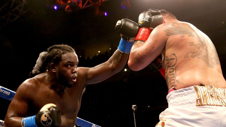 LOS ANGELES, CA - MAY 10:  Bermane Stiverne throws a punch at Chris Arreola in their WBC Heavyweight Championship match at Galen Center on May 10, 2014 in 
