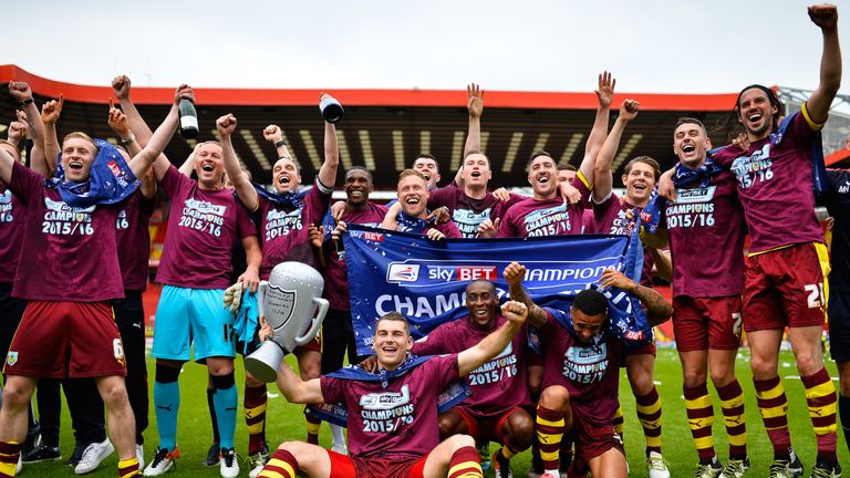 Burnley's players celebrate winning the Championship after their final-day win at Charlton
