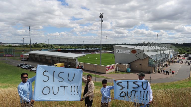 NORTHAMPTON, ENGLAND - AUGUST 11 2013:  Coventry City fans protest before the League One match between Coventry City and Bristol City at Sixfields Stadium