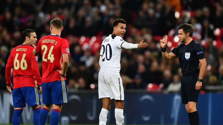 Dele Alli of Tottenham Hotspur (C) argues with the referee during the UEFA Champions League Group E match between Tottenham and CSKA Moscow