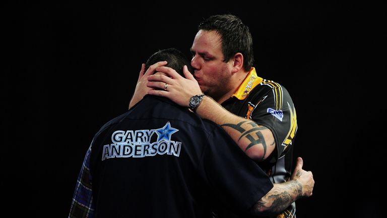 LONDON, ENGLAND - JANUARY 03:  Adrian Lewis of England (r) embraces Gary Anderson of Scotland after being defeated in the final match during Day Fifteen of