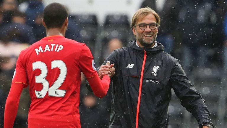 Liverpool manager Jurgen Klopp shakes hands with defender Joel Matip after their Premier League game against Swansea